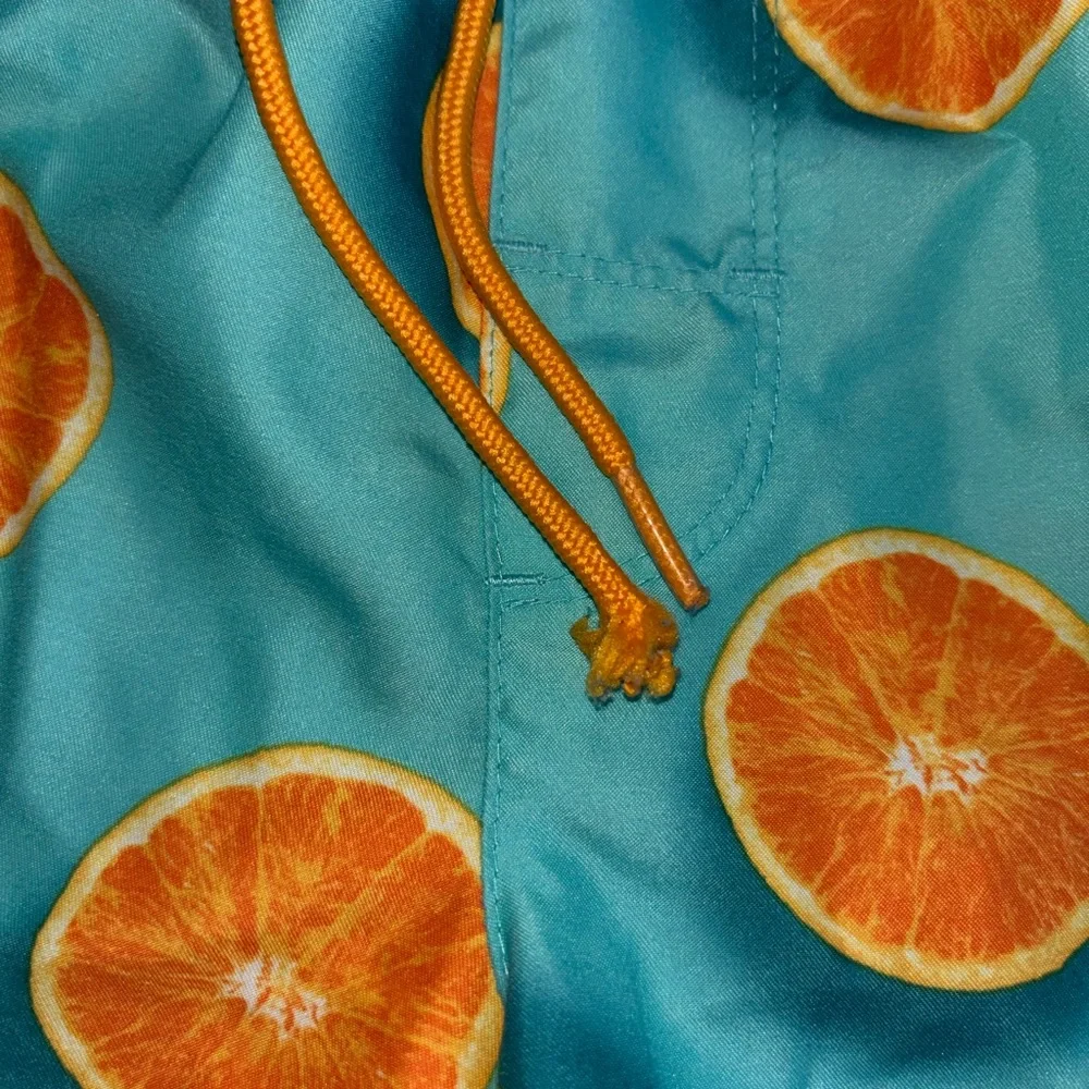 Old Navy Turquoise Swim Trunks with Orange Slice Print